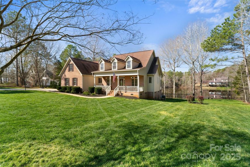 Nestled on 1.586 acres overlooking a serene pond, this stunning home features an open floor plan with tall ceilings throughout! You'll love the spacious kitchen with a large work island, breakfast bar, dining area, gas range & farm sink. The living room boasts a cozy fireplace, while the primary suite on the main level impresses with a tray ceiling, walk-in closet & luxurious marble bath with a freestanding soaking tub, separate shower & dual sinks. Secondary bedrooms share a convenient Jack & Jill bath. Upstairs, you'll find a versatile bonus room, an office (or potential 4th bedroom—septic is for 3) & a full bath providing additional living space. Outdoor living shines with a rocking chair front porch, a huge screened porch with a built-in bar, 2 decks, a firepit & partial fencing—all with picturesque pond views. A side-load two-car garage, no HOA & easy access to the interstate make this home a rare find, just 35 minutes from the airport while still offering peaceful country living.