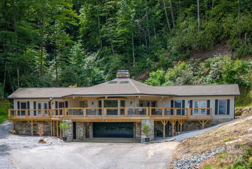 This property has it all - large upgraded home, plenty of land in a fantastic location! Unrestricted, 4 parcels sold together overlooking the Little River Valley in desirable Pisgah Forest. Minutes from Dupont & Pisgah Forests. Large main house offers over 3,200 sq ft of living space w/ 3 BR, 2.5 baths + office with over 2200 sq. ft. of living space in unfinished basement. Beautiful view of the mountains. Major improvements include NEW 50-year roof, HVAC, plumbing & electric, radon mitigation system, Rinnai water heater, 1265 sf deck … the list is extensive! Enjoy cascading stream as you sit by the fire pit or soak in the new hot tub. Watch the very rare Blue Ghost fireflies, hummingbirds and wildlife from your private backyard. Property features a 50x30 red barn, stocked pond & pasture land. 16+ acres offering a nice mixture of mountain hiking land as well as pasture land for livestock or planting.