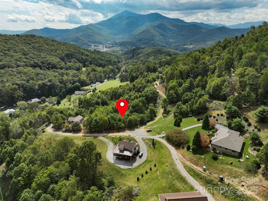 Build your dream home here! A versatile one acre lot in Majestic Mountain Estates awaits you. Long
range views of Celo Knob and just a short 10 minute drive into the quaint town of Burnsville and its
amenities. This lot lends itself to a multi-level home with a walkout deck for morning coffee
sunrises and an evening nightcap or herbal tea! Fully wooded. Owner is putting in a driveway and
homesite. Well and septic are needed. About 45 minutes to Asheville.