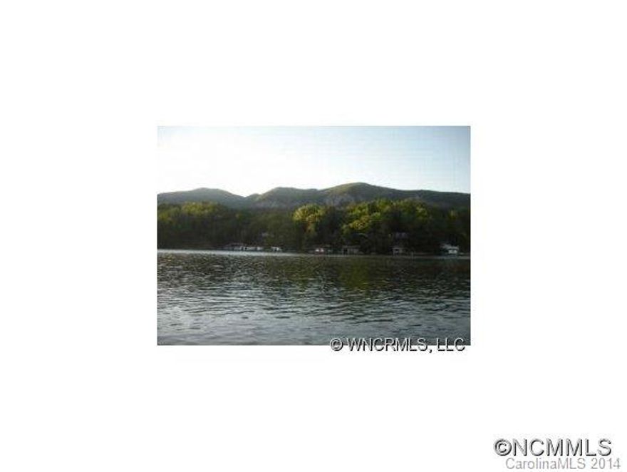 Fantastic LAKE FRONTAGE and LONG Range westerly MTN Views...this is what your looking for in Lake Lure.  A great investment or build that dream home and start living the lake life!  HUGE...$200K price reduction.