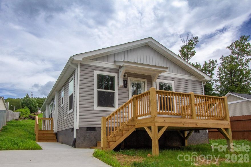 This charming New Construction home is in a convenient established neighborhood less than a 10 minute 1/2 mile easy stroll to downtown Waynesville.  The 3 BR, 2 BA light filled home offers a low maintenance yard, open floorplan, spacious kitchen w/ dining area, primary bedroom w/ ensuite bath and easy care LVP flooring throughout. Outside, a sunny front deck greets you with a west facing mountain view perfect for sunsets. 1 year builder's warranty included w/ an option to purchase an extended 5 year warranty.