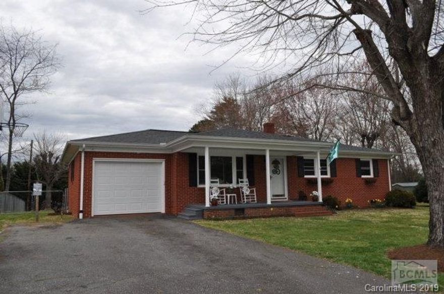 Step inside this well-kept 3 Bedroom 1 Bath ranch style home and notice the warmth of the new laminate flooring that flows from the Living Room, Kitchen, and into the Hallway. The Kitchen displays a new countertop and sink that accentuates the cabinets and warm flooring. All three bedrooms are carpeted and the Bath has ceramic tile flooring. Many features have been added to this home including a gabled front porch, windows, patio, and roof. The gabled front porch was added in 2015, roof in 2008, and a 14x30 patio with poured footings was added in 2003. The front yard is shaded by trees and the back yard is fenced in with a powered storage building. Property is conveniently located within minutes of local shopping, dining, and I-40 access.