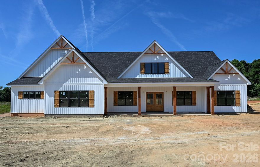 Custom 4BR + office, 3.5BA ranch home with 2-car garage on just over an acre—no HOA. Open-concept layout with 9-ft ceilings and LVP flooring throughout (tile in all baths). Exterior features vinyl board and batten with stone accents, plus spacious covered front and rear porches perfect for outdoor living. Act now to personalize your space and choose select finishes.