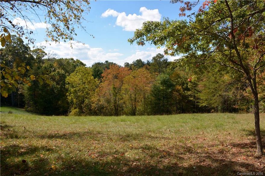 Beautiful mountain homesite for sale in Mars Hill! Nestled along a cul-de-sac in an established neighborhood boasting mountain views & city utilities. Enjoy a convenient lifestyle less than 1 mile from Mars Hill University, the public library, & local shops & restaurants! Lot sits on a nice little knoll w/ a gentle slope in back (perfect for daylight basement) & extends down to the stream below with a nice buffer of trees adding to the privacy in back.