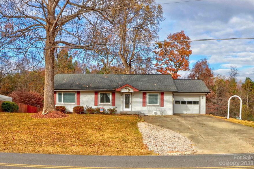 Unique open floor plan in this 1981 ranch. Inviting entry w/reading/relaxing area. Small office or craft/sewing room off entry. Step into the large living room w/recessed alcove for entertainment center. High ceilings amplify the space. Kitchen w/island range, everyone can be participating during meal preparations. Great floor plan for entertaining. Breakfast/dining nook next to pantry/laundry closet. Large 32 x 12' deck off kitchen. Primary bedroom with dual closets. and bath with walk in shower.  Deck offers ample space beneath for storage as does the crawl space at the rear.   Large shed in the back with upper level with stairs for off seasonal storage. Lower level w/cabinets and bench for workshop if desired. Spring Shore is a community with NO HOA, offers a community boat ramp with tie ups for daytime to enjoy time on Lake Norman.  Quiet community at north end of LKN and near LKN State Park to enjoy the public beach and walking trails.