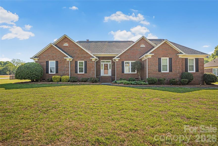 Classic all-brick ranch offering easy Carolina living on a spacious .70-acre corner lot with a side-load 2-car garage and fenced rear yard. This well-maintained home features no carpet throughout, providing a clean, low-maintenance interior.

Step inside to a bright, open living room with vaulted ceilings and a cozy fireplace—perfect for relaxing or gathering with friends. The expansive sunroom is a standout feature, ideal for enjoying morning coffee or taking in peaceful backyard views year-round.

The flexible floor plan includes a formal dining room that can easily serve as a home office, along with a large eat-in kitchen designed for everyday comfort. A separate laundry room with sink adds extra convenience.

The primary suite offers a private retreat with a trey ceiling, walk-in closet, and en-suite bath complete with a soaking tub and separate shower. Outdoors, enjoy a spacious deck—perfect for entertaining, grilling, or simply soaking up the Carolina sunshine.

Located just minutes from downtown Monroe and a short drive to the Village of Wesley Chapel, offering great shopping, dining, and entertainment options.

**professional measurements Monday April 20th****