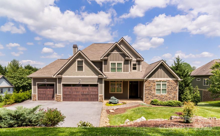 Welcome to an extraordinary home of space, light and luxury in the gated golf course & mountain community of High Vista! Built to accentuate impressive open concept living with the beauty of the outdoors, step through the grand entry to a 2-story great room, hickory hardwood floors & a chef’s kitchen with custom cabinetry & room for gatherings at the large kitchen island. French doors open to an all-season screened porch with gas fireplace, professional custom grill and outdoor deck. Mudroom w laundry nearby the primary bedroom with private deck, spa-like bathroom & generous walk-in closet. Head upstairs to 3 bedrooms (one en suite) then down to the 9'+ ceiling finished walk-out basement with another bedroom, bath, office, gym, wet bar with kegerator, media room with fireplace & laundry room. Ideal for au pair suite. POA charter membership available ($10k value) with member-only access to a fantastic pool, pub, sports courts & more. 3-car garage. Make this sanctuary yours! Agent owned.