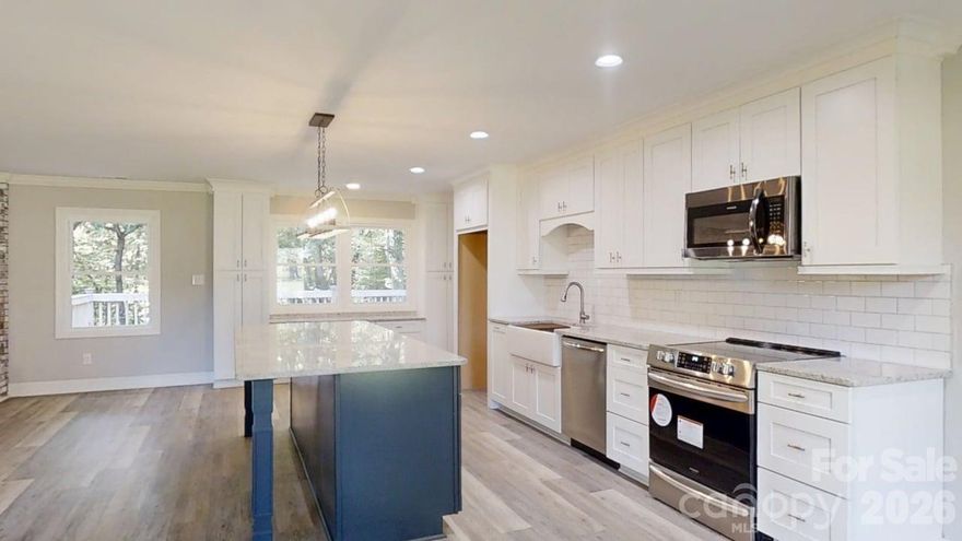 North Lincoln Schools + 1.88 Wooded Acres + Renovated Home.
If you’ve been dreaming of a little more breathing room without giving up convenience, this beautifully renovated home in Iron Station delivers the balance so many buyers are searching for.

Tucked back from the road on 1.88 wooded acres, this 3-bedroom, 2-bath home offers nearly 2,000 square feet of thoughtfully updated living space and an attached two-car garage. Mature trees create a natural setting where mornings begin with quiet coffee on the deck and evenings bring the peaceful rhythm of country living.

Inside, the home blends classic construction with modern updates. The fully refreshed kitchen features new cabinetry, brand-new appliances, and abundant storage, making it both functional and welcoming for everyday living or gathering with friends and family. The spacious living room centers around a feature fireplace, creating a comfortable space for relaxing evenings or hosting guests.

Bathrooms have been thoughtfully redesigned for comfort and style, while the bedrooms are filled with natural light thanks to new windows throughout the home. Practical touches make daily life easier, including a drop zone entry from the garage and a laundry room conveniently set away from the bedrooms.

Step outside onto the large back deck overlooking the wooded acreage, where you can watch deer move through the trees, host weekend gatherings, or simply enjoy the quiet that comes from having space around you.

One of the most appealing aspects of this property is the location and lifestyle it offers. Families appreciate the highly regarded North Lincoln “neighborhood schools,” while commuters will find Charlotte within approximately 30 minutes. For recreation and weekend enjoyment, Lake Norman is only about 15 minutes away, offering boating, fishing, waterfront dining, and endless outdoor fun.

For many buyers, this home represents a welcome change from crowded subdivisions and heavy HOA restrictions. Here, you can enjoy privacy, room to breathe, and the freedom that comes with having your own space, while still remaining convenient to Denver, Lincolnton, and the greater Lake Norman region.

If you’ve been looking for a home that combines updated comfort, wooded privacy, and access to everything the Lake Norman area has to offer, this Christopher Road property is ready to welcome you home.