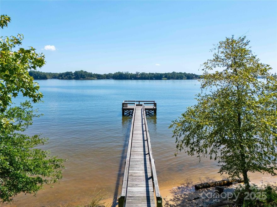 Deep Water Paradise on the Main Channel - this is the one you've been dreaming of! A 0.72 acre lot that delivers a truly breathtaking, panoramic view that perfectly captures the essence of lake living - imagine waking up to this view every day.  A cozy, secluded cabin complete with a screened-in porch is the perfect place to enjoy the tranquil surroundings and envision the future. You'll have the ultimate water access with over 200 feet of shoreline and a wonderful dock that was built in 2015.  Whether by land or by water, this waterfront gem is a must-see that you'll undoubtedly fall in love with!