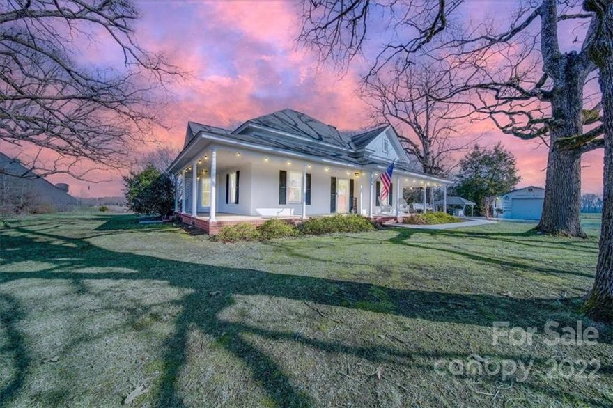 Charming and welcoming 1905 home on 1.20 acres. Beautiful heart-of-pine floors, modern lighting, spacious rooms, kitchen with plenty of counter space and a breakfast bar.  Sellers installed a wood stove and home has a beautiful wooden mantle. The home boasts a wraparound porch and a portion of the yard has a small fence. Hardie plank siding replaced much of the original wood on the outside of the home and the walls were insulated and Tyvek wrapped. Sellers recently painted interior of entire home, had all popcorn ceiling removed, installed a smart thermostat and painted the porch.