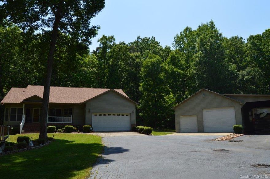 Wonderful lot. Approximately 4.92 acres. Must see location. Very private. 3br/2ba on main. Nice kitchen with granite countertops and bar area. Walk in pantry. Large laundry room/mud room.  Open great room. Master bedroom leads to screen porch. Wonderful covered porch. Nice bonus/br with half bath. Roof in 2014. Possible 2nd living quarters with heated and cooled br/office with laundry room and full bath in approximately 1500 sq ft detached garage plus covered carport for RV.