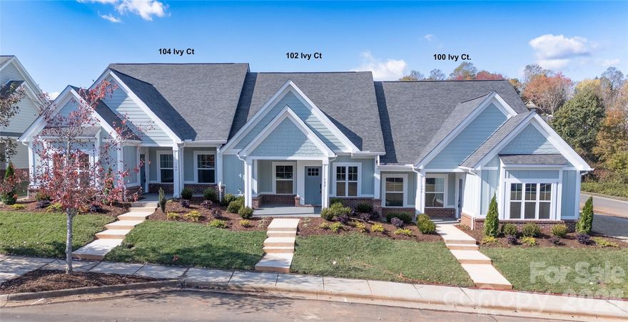 Elegant single-level living awaits in Henry’s Glen. This brand-new townhouse, just minutes from downtown Morganton, offers an open-concept design with a soaring vaulted great room that blends the living, dining, and kitchen areas. A cozy gas fireplace anchors the space, while the chef’s kitchen features custom cabinetry, quartz countertops, and a full suite of appliances.
The home includes two spacious bedrooms and a hall bath with ceramic tile. The private primary suite opens to a patio retreat and boasts a walk-in closet plus a spa-style bath with ceramic flooring and a walk-in shower.
Thoughtful details abound—9-foot ceilings, crown molding, luxury flooring, and designer finishes throughout. An oversized single garage with rear-street access adds both convenience and curb appeal. Completion is scheduled for October 2025—secure your place now in this sought-after community.