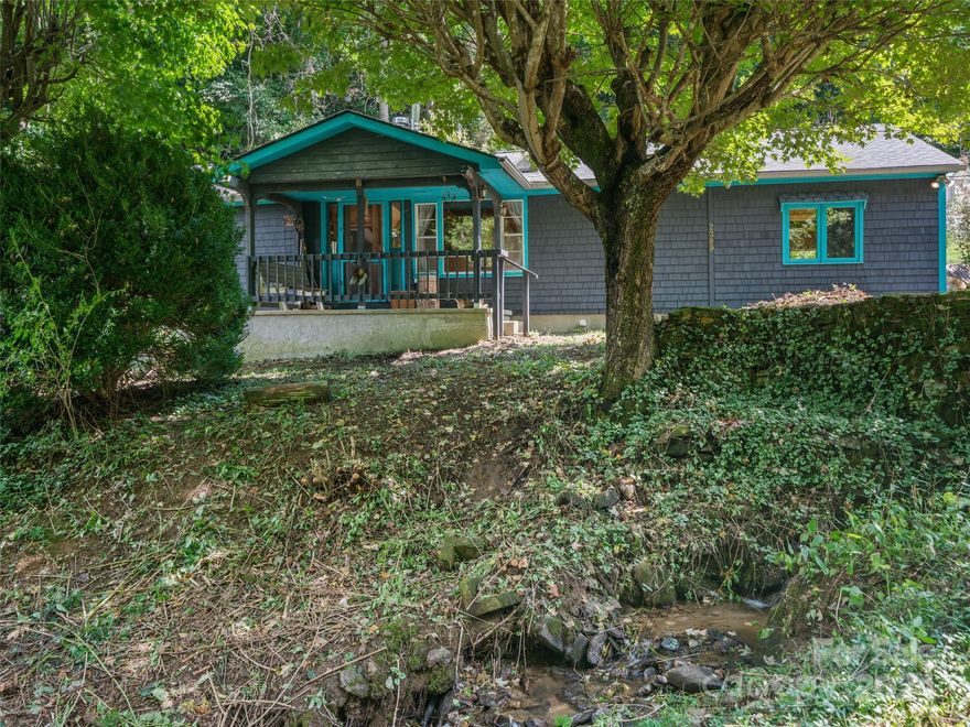 Perfectly located at the end of Bakers Creek Rd. on the coveted West Side of Yancey County is this renovated and loved on home. The attention to woodwork and tile work throughout this home makes it truly a work of art and the usage of every square inch to allow for maximum storage all throughout giving this home efficiency of ultimate functionality for even a large family to co-habitat. The furnace floor system is complemented by auxiliary heat system from 3 woodstoves resting in the living room, primary bedroom and a old wood-fired stove add to home's efficiency. Outside the home rest a well planned greenhouse with built-in raised beds and garage/workshop/artist studio for multi purpose usage. Garden area and outdoor oven and Both Spring reservoir and a hardy creek on the grounds make homesteading and green living a very real possibility. Front porch is so peaceful with sounds of creek flowing and birds chirping and allows taking in the Mtn. views
