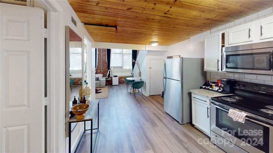 Fabulous condo converted from an old mill bursting with character. Decorated fabulously with an urban artist feel. Exposed brick walls, oversized windows, beautiful wood ceilings, and so much more.  One private bedroom and a loft in the upper floor.    Pets are conditional with owner approval. Laundry services in the building, parking in front of the building (first come first served), water utility included. Close to the interstates, and the booming west side of Charlotte with easy access to airport. Unit can be rented fully furnished or unfurnished!