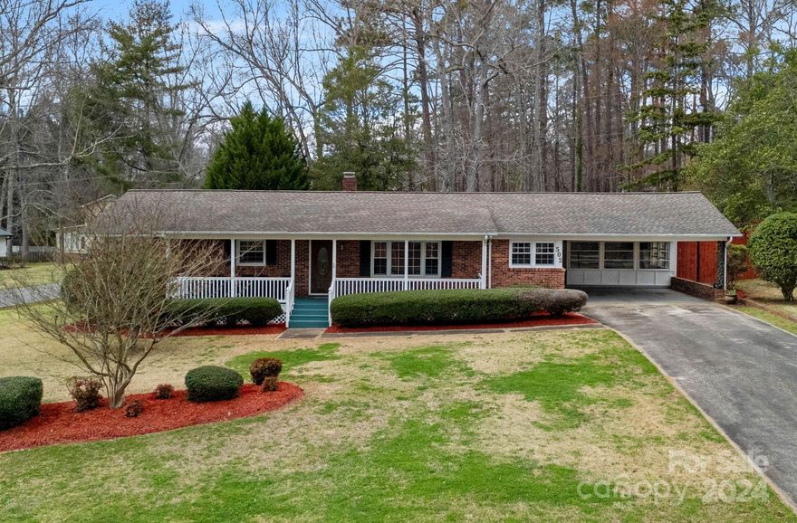 Nestled in the heart of Lancaster, South Carolina, this timeless brick ranch offers classic charm and modern comforts. Built in 1965, the home boasts 3 bedrooms and 2 full bathrooms, with new flooring in the breakfast area, kitchen, and family room. A cozy brick fireplace adds warmth and character to the living space. Step into the sunroom, complete with a large storage closet, offering a tranquil retreat to enjoy the outdoors.  Additional storage space, accessed from the back of the home, provides practical convenience. With a two-car carport and a sprawling backyard enclosed by a privacy fence, this corner lot residence offers ample space for outdoor enjoyment and entertaining. Surrounded by mature trees in a well-established community, this home presents a perfect blend of comfort, convenience, and Southern charm.
