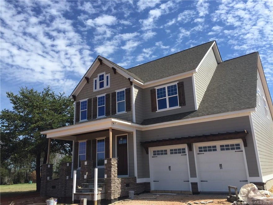ALMOST COMPLETE!  New construction in Grand Oaks at Lake Norman. This is a small restricted community with only 10 lots and no HOA Dues. The craftsman style home has a dynamic open floor plan and  offers high end features and details. Site finished wood floors, coffered ceilings, fabulous kitchen and so much more!! Master on the main adjoined by a luxurious master bath. Large level lot in an ideal location!