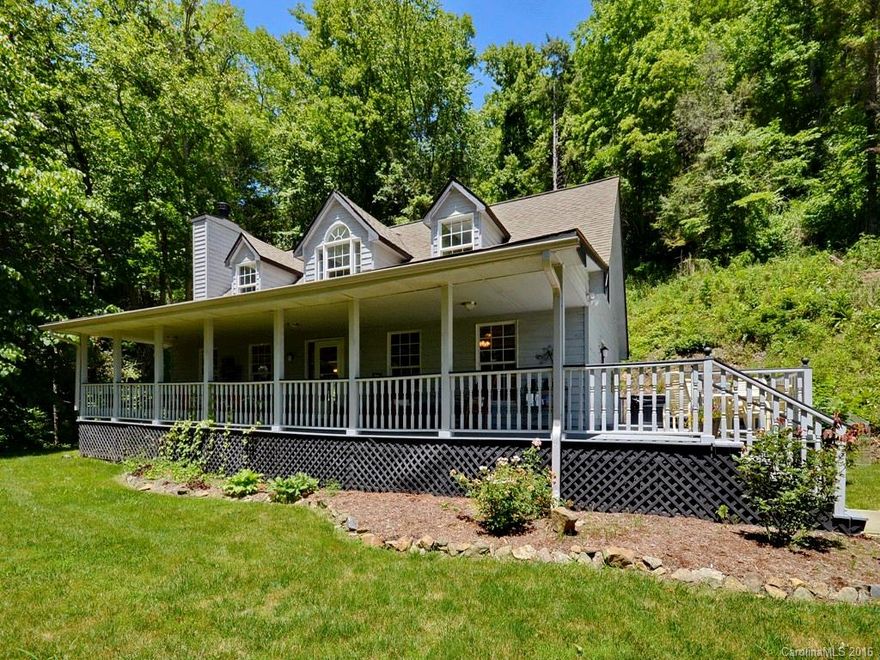 Enjoy year round porch views & waterfall from this private mountain home-just 13 miles from downtown Asheville. Beautiful Cape-Cod 3/3 with master on main - each bedroom has its own full bath. Open kitchen/dining area, wood burning fireplace in living room, large 2-car garage. This property has it all, stream, waterfall and views!