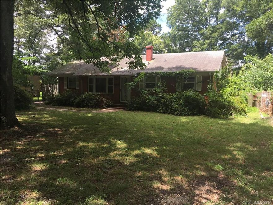 Handyman special! This brick ranch features a great floor plan, hardwood floors and a large kitchen. Home has central HVAC and updated windows. The lot is fenced and includes a storage shed and a wired metal shop! Ton of potential here. The home is located close to shopping and I-85.