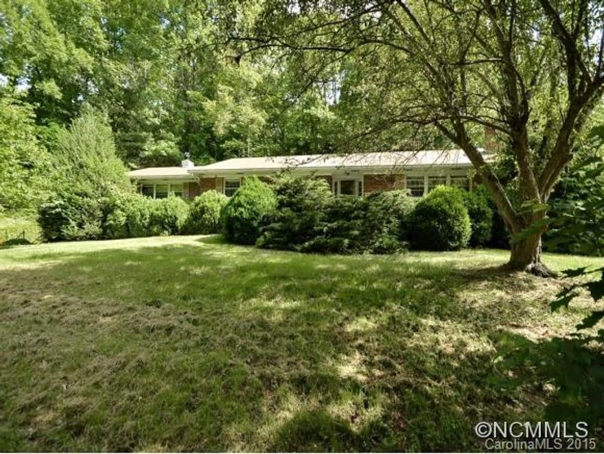 Solid brick Ranch on full unfinished basement, workshop space, & double garage in basement. Great storage in walk up attic space off hallway. Living room, dining room, & large family room. Great potential w/updating. Located near Mars Hill University. Mature landscaping & private setting. Seller says hot water heater is not functioning. Property is being sold through a Guardianship. Seller will make no repairs.
