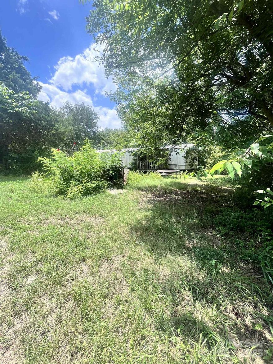 This lot is in a prime location in McConnells. There is an older mobile home that is not included in the sale that will be moved prior to closing. There are no restrictions, a mobile home or stick built are both allowed. Come build your next home here! This one won't last long!
