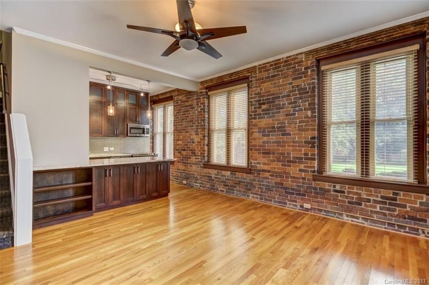 Incredible updated condo in the heart of Uptown!  The main floor features an updated custom kitchen with granite counters and stainless steel appliances, hardwood floors, park views and exposed brick walls.  Upstairs includes two bedrooms with a custom closet system and a remodeled bath.  Unbeatable location less than one block to grocery, and 3 blocks to Trade and Tryon!
