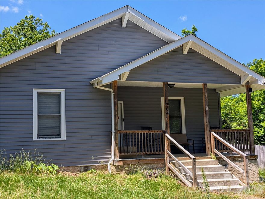 Opportunity near Lake Rhodhiss with plenty of potential. This 3-bedroom, 1-bath bungalow offers one-level living with 1,139 square feet and a classic covered front porch that adds to the home’s welcoming feel. Inside, the layout is functional and straightforward, with laundry located in the kitchen and a spacious backyard offering room to enjoy the outdoors on approximately .61 acres. A rear covered porch provides additional outdoor space for relaxing or storage. Built in 1918, the home has seen updates over the years and is ready for its next chapter. This home is conveniently located near Lake Rhodhiss in the coveted Ray Childer's school district. This is an affordable opportunity for buyers looking to personalize a property, or for investors to grab a deal. Short sale subject to bank approval.