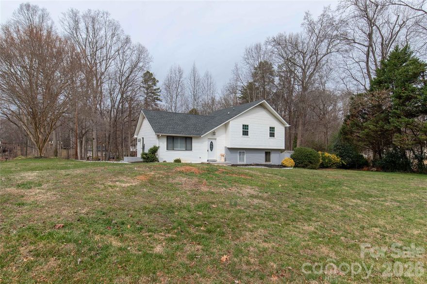 Spacious tri-level home on a corner .80 lot. This 4 bedroom 3 full bath home offers a little over 1800 sq ft, fresh paint, and carpet in the bedrooms. Relax on your rear screened-in porch overlooking the back yard w/inground pool. A 24 x 26 wired workshop is ideal for hobbies and projects. An additional storage building to put more toys in.