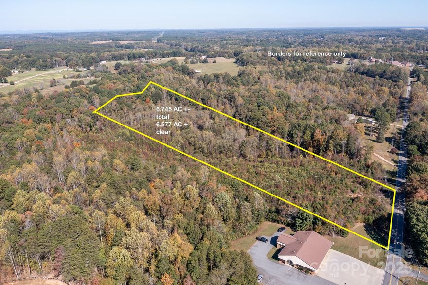 Spacious 6.5+ acre lot in a convenient Sherrills Ford location. Private, wooded setting offers peace and seclusion while remaining close to local amenities. Perfect opportunity to build your dream home or establish a private homestead. No perk test on file. Call agent for more information.