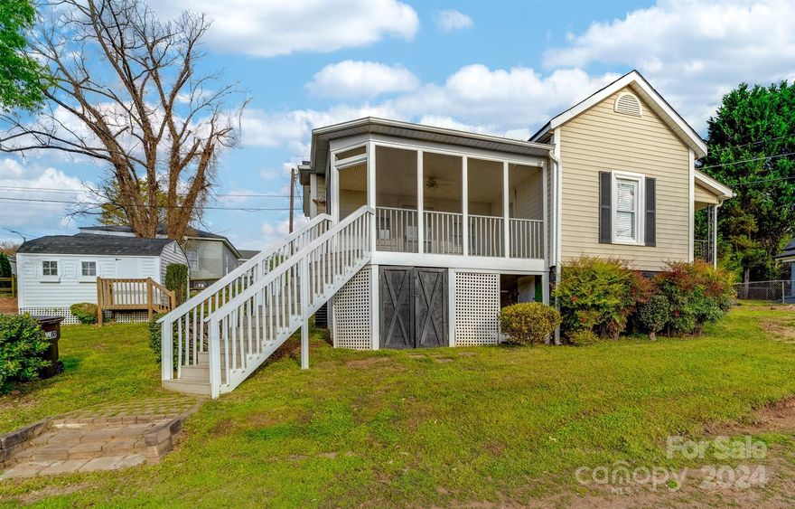 Completely adorable! 1BR Perched up overlooking Riverside Park and Greenway! Two vantage points to relax outside with the 30 ft long covered rocking chair side porch or the Greenway view from an elevated screen front porch! Owners have keep this home meticulously maintained throughout ownership. Beautiful refinished original hardwood floors, a very spacious master bedroom with extended master closet! A quaint Living room and open kitchen area with all appliances included present at time of showing. Garden outbuilding included. Circular driveway. Wide lot with several spots to have a garden! Circular driveway. Within walking distance to downtown Cramerton and Goat Island park!  Beautiful new construction and revitalization occurring all around!