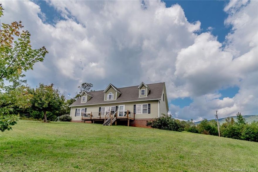 Amazing views! Beautifully updated home on 10 acres. Two master suites with large walk-in closets. Renovated kitchen has stainless steel appliances and gorgeous reclaimed wood countertops. Main floor living space with propane fireplace and two additional bonus rooms that provide enough space for all your needs! Enjoy outdoor living on two oversized decks, one of which extends the length of the house. Partially finished basement with potential ensuite and large metal barn. This is a must see!