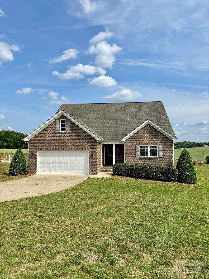 Welcome to this beautiful home perched on the countryside of a great Union County community. With a large and full primary suite on the main floor, expansive additional bedrooms and a huge upstairs bonus room this home offers tons of space inside and with an acre of land you have plenty of space to enjoy the days outside as well. Be sure to catch the dedicated basketball court, outdoor grilling station and seating area and gorgeous countryside views from the back deck. This is a great opportunity to check all the boxes! Many great features including tankless water, custom tile shower and a large open floorplan that is inviting and ready for new memories to be made. Piedmont Schools and Piedmont country living make this great house the perfect place to call home!