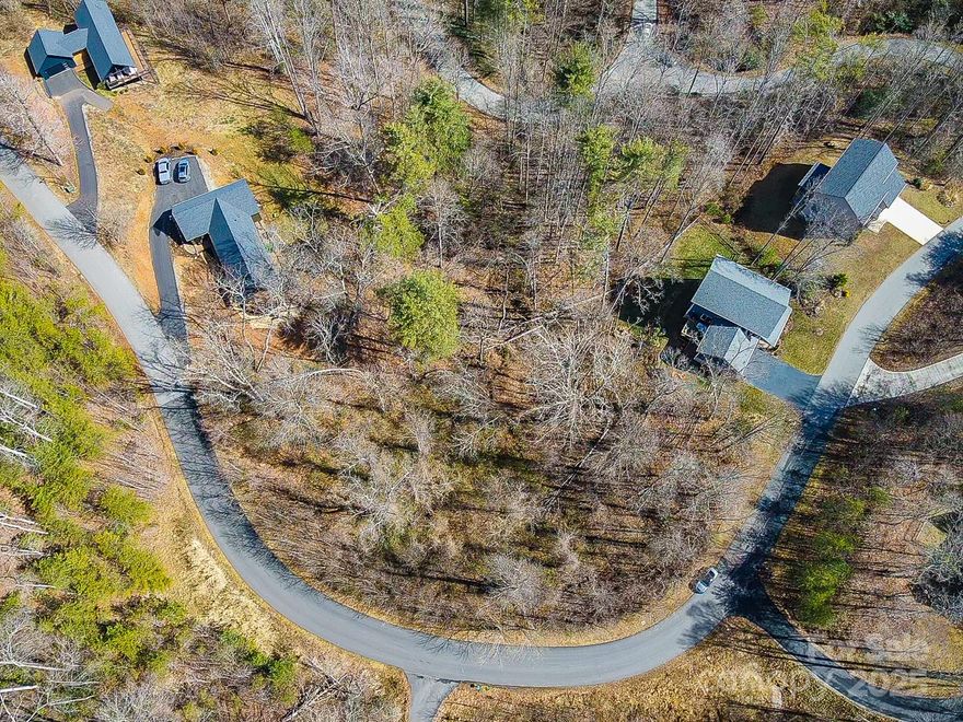 This great lot in Rock Springs subdivision is 1.41 acres and can be accessed from within the subdivision or off Gorman Bridge Road! Many new homes have been built within the subdivision! Come join this great community and build your dream home in a prime location in Woodfin just 15 minutes to downtown Asheville and all that Asheville has to offer! Septic permit attached. At this price, this lot will sell super fast! Come see it today!