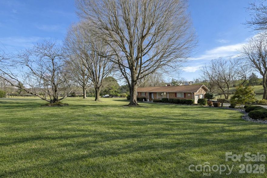 Bring your horses and embrace the country lifestyle in this beautifully remodeled all-brick ranch set on 6.8 acres in Mooresville. Backing up to the original Johnson Dairy Farm property, this rare find offers the perfect setting for equestrian living and includes two separate parcels. The land has been thoughtfully laid out with four fully fenced pastures, providing ample space for grazing, rotation, and training. Surrounded by wonderful neighbors who value the peaceful, rural setting, this home offers both privacy and a true sense of community.

Inside, you’ll find stylish LVP flooring throughout, a spacious laundry room, and abundant storage, plus a 424 sq. ft. unfinished walk-in basement that’s perfect for tack, tools, or extra storage. Equestrians will love the 3,000 sq. ft. metal barn, complete with 2,000 sq. ft. of open storage and two oversized exterior horse stalls. With wide-open acreage, there’s plenty of room to ride, train, or simply relax and enjoy the quiet countryside.

Perfectly situated between downtown Mooresville and downtown Davidson, yet outside the city limits with county-only taxes and no HOA or restrictions, this property combines convenience with the freedom to create your dream homestead. Whether you’re looking for a place to keep your horses, build a sustainable lifestyle, or simply enjoy a private retreat, this home offers it all.