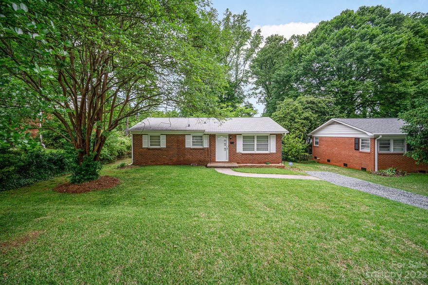 *** Multiple offers received. Deadline ADJUSTED for SUNDAY, April 30th at 5pm ***

Take ownership of this legacy Charlotte home! Family-owned since 1958!

10 minutes to uptown/city center and 5 minutes from Plaza Midwood, NoDa, and more!

This single story brick home greets you with a spacious living room at the main entrance. The home contains two primary bedrooms off of a main hallway with wood flooring. A third room beside the kitchen can be used as a bedroom, den, dining area, or office! A utility room with laundry hookups and an enclosed back porch are connected to the kitchen.

Concrete patio areas on the front and back of the house will allow you to relax and enjoy the beautiful property and the mature neighborhoods of Markham Village and Windsor Park. Owners have recently laid new gravel for the driveway, cleared outdated exterior structures, and performed landscaping updates. No HOA!