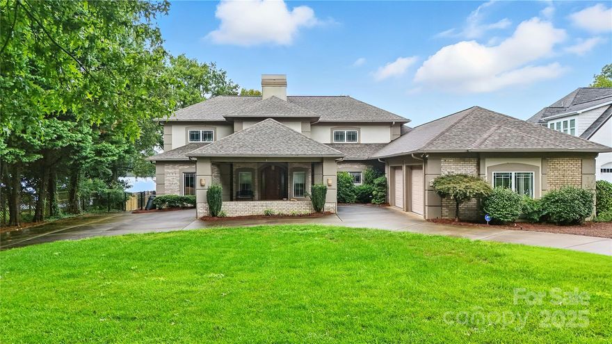 Big, beautiful views from this gorgeous waterfront lot. Custom home has primary bedroom on main level with large primary bath with a double vanity, sauna and oversized walk-in closet.  1/2 bath also on main level. 2 large bedrooms upstairs with full baths. Upstairs walkway overlooks family room and foyer.  Office with built-in cabinets and desk with views of the lake.  Large kitchen with walk-in island and plenty of cabinet space. Unique Gaggenau Cooktop and Double ovens.  Kitchen also has a separate bar area.  Oversized garage with included cabinets and sink.  Vaulted ceilings give this home a gorgeous open concept. Fenced in backyard.  The pier has some damage and parts were dismantled after Hurricane Helene.  Original Duke Energy permit attached.