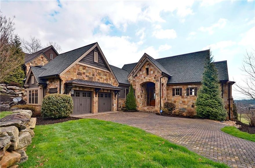 Enjoy breathtaking views of the Jack Nicklaus signature golf course of Walnut Cove as well as longer range views of the eastern mountains. Old English country architectural style meets maintenance free luxury living in The Meadow enclave at Walnut Cove.  Granite counters everywhere, commercial-grade kitchen, phantom screened patio and main-floor living make this the perfect full time residence or seasonal retreat. Full Golf membership available.