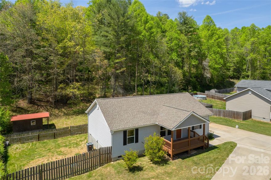 I am a younger, open, one level, split floor plan, accessible home with modern appliances and gladiolus that bloom in multiple colors! You have your choice to sit on my front porch and back deck while you have your morning coffee, grill out, host friends and family or sip a cool crisp Diet Coke in the afternoon. I have a nice, tall fence surrounding me that loves to keep your furry friends safe! You gotta check me out today! With ample parking, a primary suite, nice sized bedrooms, dedicated laundry space, a huge pantry off the kitchen and great closet storage, theres not much more you could ask for. Also, did I mention I’m down where Leicester highway is still two lanes? What you know about that? It’s nice and quiet with a little country! Come see me today!!