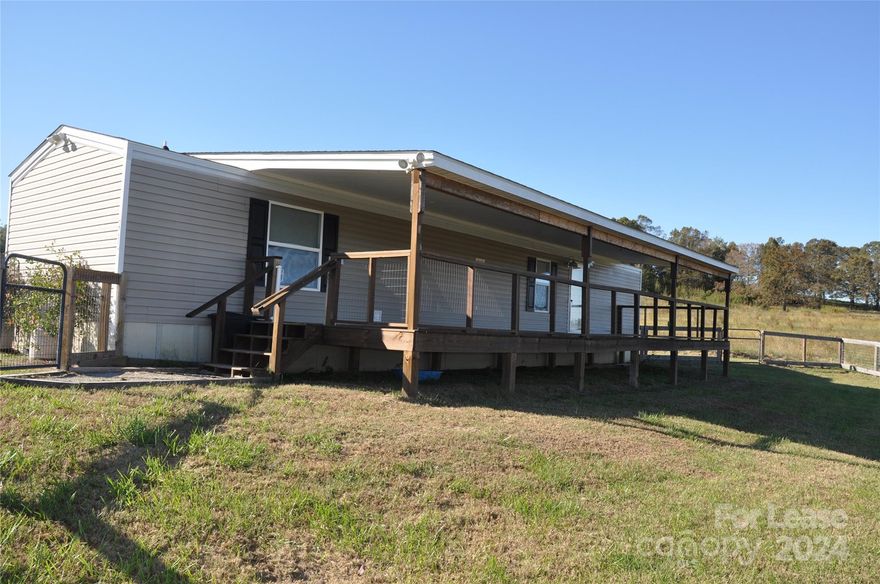 Newer 2 bedroom, 2 full bath unfurnished modular home for rent. Beautiful long range pasture views. Primary bedroom with en-suite full bath. Second bedroom and full bath at opposite end of house could be used for an office. Well equipped kitchen with attached laundry room.  Includes full size washer and dryer.  Huge covered deck and fenced back yard.  1 year lease and 1 months security deposit required.  Tenant is responsible for utilities, internet and yard care.  Pet will be considered on a case by case basis at the discretion of the Landlord.  Shown by appointment only.