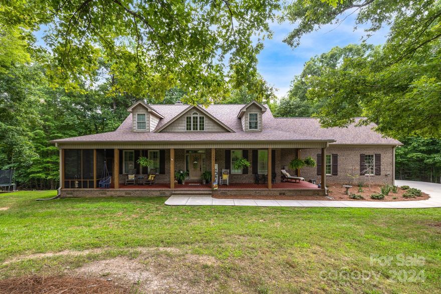Welcome to your dream home! This stunning residence has a great room with vaulted ceilings and a beautifully crafted tongue-and-groove pine ceiling. Complemented by hardwood floors throughout the main living areas. Kitchen features granite countertops with a tumbled stone backsplash. French doors lead to the dining room, while the breakfast area offers a charming bay window with serene views of the backyard. Relax and unwind in the beautiful screened-in porch. Explore the potential of the spacious unfinished bonus room above the garage. The full walk-out basement, partially finished with stained concrete flooring, includes a convenient kitchenette and bathroom, making it an ideal space for entertainment or relaxation. For your hobbies and projects; 15x35 workshop with a concrete floor awaits, along with a 14x20 recreation shed featuring front and back porches along with a cozy wood-burning stove. Don’t miss this extraordinary opportunity to make this exquisite property your own!
