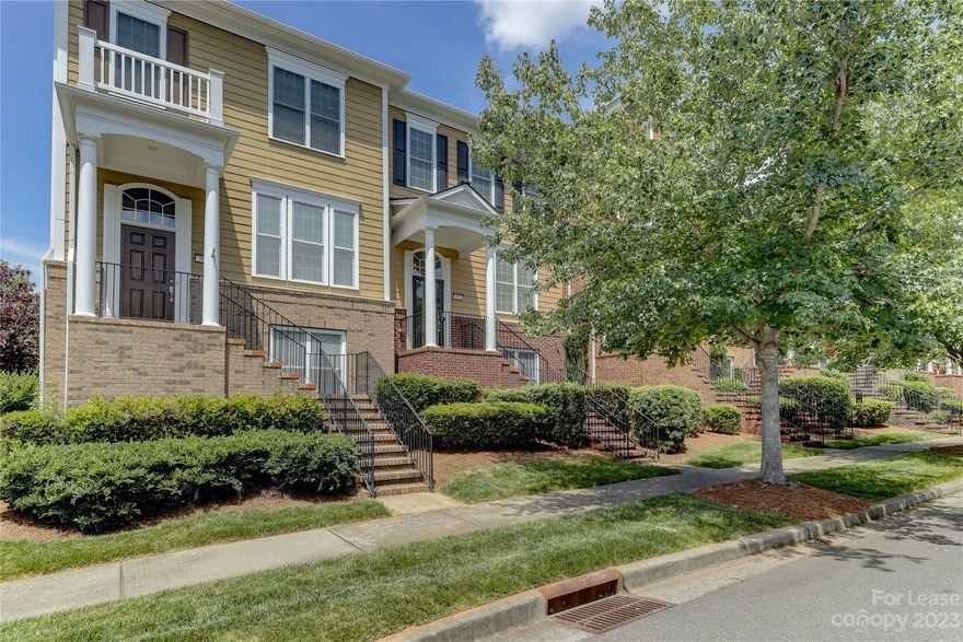 Fantastic updated townhome just steps from Baxter TownCenter, featuring popular restaurants, Starbucks, wine bar, fitness center, the Fort Mill library, & much more. This townhome has it all with updated lighting, new tiled kitchen backsplash, new quartz countertops in kitchen & bathrooms, new LVP flooring, new tiled fireplace, all new KitchenAid Appliances w/ gas range, center island in the kitchen, & extra full sized fridge in garage. This 3-bedroom, dual-primary bedroom floor plan works great for a variety of situations! Primary bedrooms feature walk-in closets with built-ins! Each bedroom has its own full bathroom, plus there is a powder room on the main level. The spacious great room has a gas log fireplace. The lower level features the 3rd bedroom w/ full bath & large walk in storage area. Plus 2-car garage w/ excellent storage & plenty of parking! Convenient access to I-77 and easy commute to Charlotte. Don't miss your chance of enjoying all that Baxter Village has to offer!