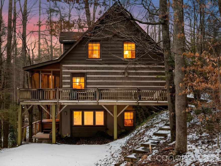 Tucked into the natural beauty of Black Mountain, this custom log cabin is the kind of property that checks every box; lifestyle, privacy, and income potential. An established short-term rental with years of proven income history with hot tub and game room.  This is truly an investor’s dream, or the perfect hybrid property for someone who wants to enjoy mountain life while their investment works for them. Step onto one of the peaceful porches and unwind to the serene sounds of Rush Creek flowing nearby. Whether it’s morning coffee wrapped in a blanket or evenings under the Carolina stars, this cabin delivers that authentic mountain experience buyers crave. The custom log construction brings warmth and character, blending rustic charm with comfort that's the kind of place guests return to year after year. An additional .70-acre adjoining lot is included, creating a natural buffer of privacy and long-term value. Extra space. Extra protection. Extra potential.  Cabin is being sold fully furnished and has a whole house generator.  Just bring your toothbrush and hiking boots!