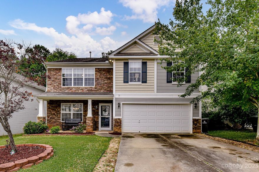 Beautiful five bedroom home located close to the Country Club with a great front porch, just in time to enjoy the summer! The spacious dining room welcomes you as you enter the home. All new LVP throughout the home. No carpet at all in the home except the primary closet. Open concept with a cute kitchen, opening to the breakfast and family room with fireplace. Guest bedroom and full bath on the main floor. Upstairs you'll find three more generous sized bedrooms with a full hall bath. The grand primary bedroom features a vaulted ceiling and an updated shower and an enormous closet. The large back yard you will find a fireplace and a large paver patio with privacy fence. Don’t miss out on this great home.