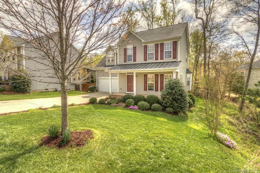 This low maintenance 2-story vinyl home located in highly desirable Fort Mill should not be missed!  Great location & schools.  Features include 3BR's plus a large bonus upstairs.  Hardwood floors downstairs and new carpet.  Formal DR,  Kitchen includes; gas range/oven, Corian counters, Fridge & dishwasher. living room w/fireplace and an additional flex room (could be study, rec. room, etc.).  The yard is fenced and surrounded by a wooded common area.  Buyer/Agent to verify all pertinent info.