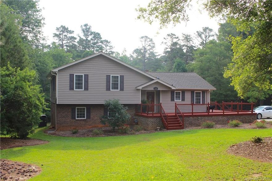 Amazing split-level home on 1.34 acres of private, wooded lot. Home has been upgraded throughout with complete kitchen remodel featuring granite countertops, detailed tile backsplash, under-cabinet lighting and crown molding. Remodeled bathrooms and a step down into spacious bonus room that can also be used as a 4th bedroom. Details throughout the home make this the 'one'. Don't miss out! Notice the care and upkeep that is evident in every aspect of this home. No HOA dues. Move-in-ready today.