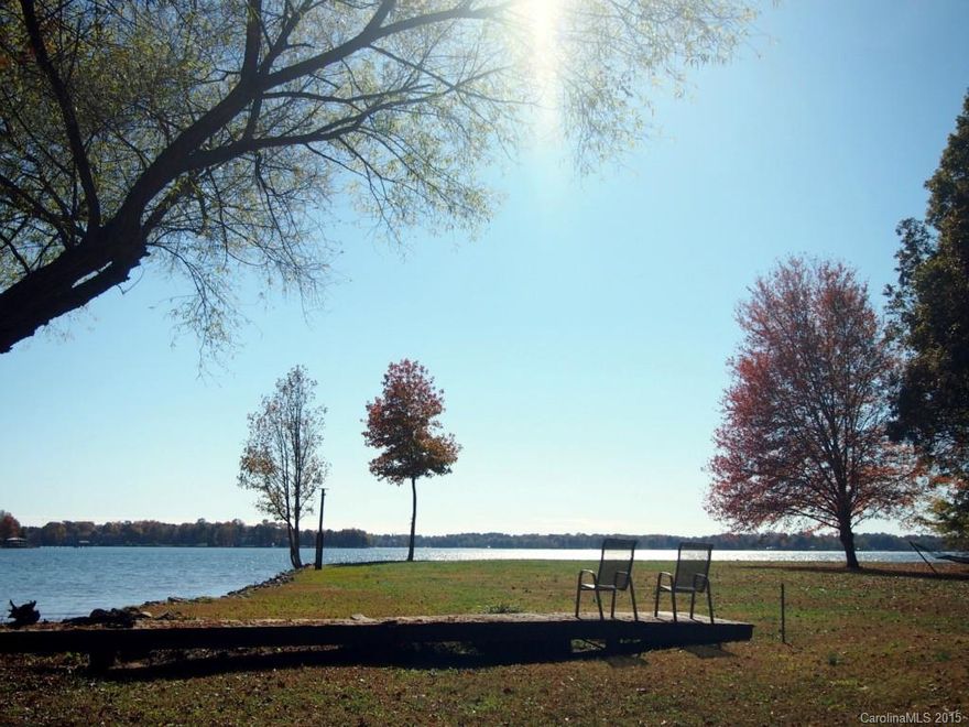 LOCATION, VIEW ACREAGE & SHORELINE!! Home is right off the new Langtree exit that will be home to shops & dining. Keep the current home or build your dream home. The possibilities are endless w/2.36 acres & and the  incredible shoreline. Beautiful views all the way around! An additional point home with 1.1 acres/300' of shoreline can be purchased with this property.