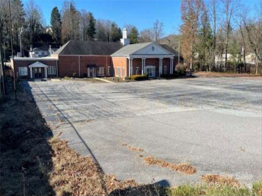 2.01 of prime commercial acres in Hendersonville just 3 blocks from the Pardee Hospital complex and .5 miles from Hendersonville High. Property is zoned C-3/Highway Business. Existing 19,900 sf building needs significant updating and is sold as-is with all FFE included. Property is in receivership with Roberts & Stevens PA and any offer is subject to court approval. Property is partially flood encumbered.