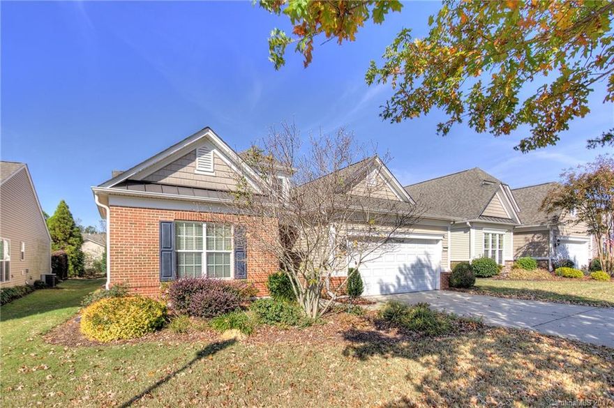 Popular Vernon Hill plan with three bedrooms, office, & sunroom. Meticulously maintained-new furnace and fresh paint. Wonderful open plan with large kitchen island that opens to living area w/ built in cabinetry and gas fp.  Master with tray ceiling, bath has dual vanities, walk in shower, garden tub, and a walk in closet. Two nicely sized secondary bedrooms w/ private hall. Extended patio w/ retractable awning. Perfect location within walking distance to club house!