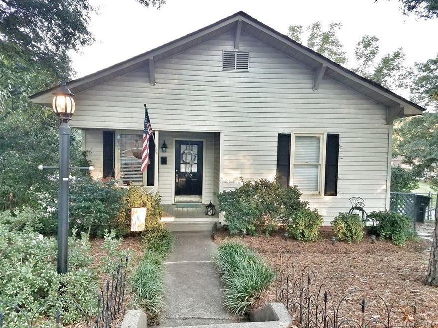 Welcome to the cutest little mill house you ever did see! Perfect for a starter home, investment, or down-size. Situated on a large lot containing 2 parcels, fenced-in backyard, and even fruit trees! This 1 bedroom, 1 bath home actually feels quite spacious with high ceilings. Has original hardwood floors, classic charm of a 1930s home, but with some great modern updates. Huge back deck (12' x 28') for entertaining that is to die for! Unfinished basement that is perfect for extra storage.