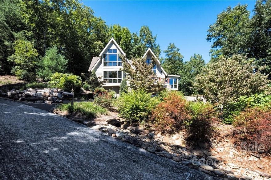 Stunning Custom built home located in a gated community. The home boasts high end appliances, quality built features too many to mention through-out the home. Main level living w/great room w/fireplace, Master bedroom, walk-in closet, office/den, gourmet kitchen, laundry room & screened porch off the kitchen and open deck to take in the long range mtn. views off the great room. Upper level has 2 bedrooms, 2 full bathrooms, with walls of glass to take in the views. The lower level boasts a wet bar with wine refrigerator, family room and a half bath.  Community has a club house, pool, hot tub, picnic area, fitness center, elevator, separate sauna for both his & hers and approx.. 6.5 miles of hiking trails to some of the prettiest waterfalls around. Location approx. 10 miles from shopping, restaurants, theater, grocery stores, air ports and hospitals .