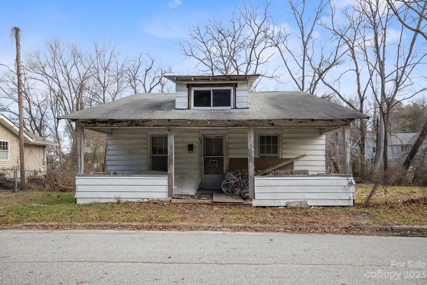 **Investor Special close to Downtown Hendersonville!!** Located several blocks from Main Street, Hendersonville and two blocks from the Ecusta Trail, this almost quarter acre lot is ready for a complete update. Many possibilities with this incredible location. Please use caution if entering dwelling.